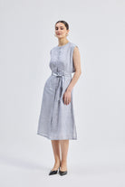 Reisto.r Back Cut Out Linen Dress in grey, front-side view of women’s sleeveless breathable linen midi dress with waist tie belt and relaxed elegant fit.