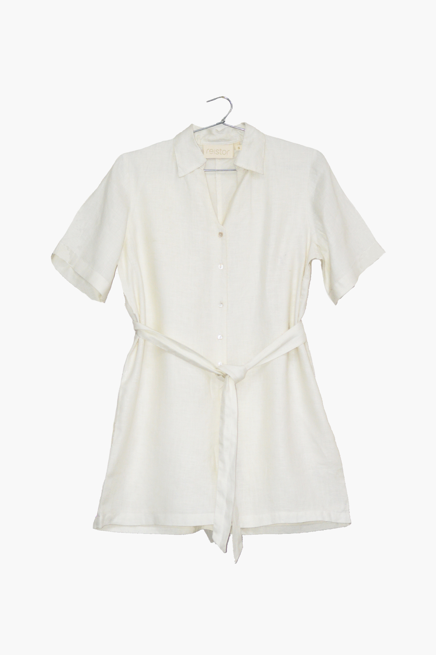 White dress on a hanger against a white background