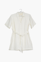 White dress on a hanger against a white background