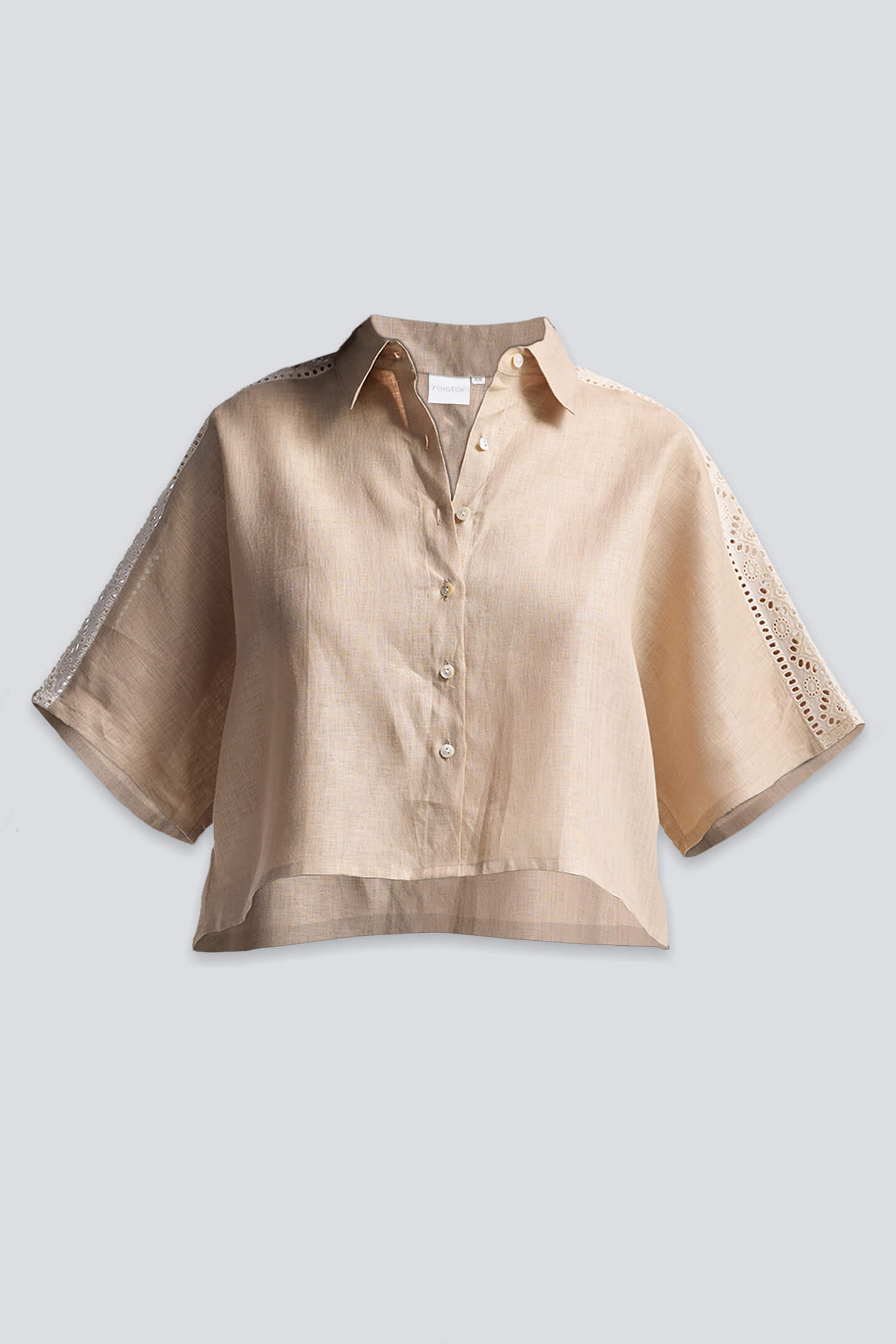 Front view of the neutral beige Boxy Shirt with Lace by Reistor, featuring a cropped, relaxed fit and button-down front.