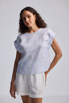 Rear view of the reistor Boxy Top with Sleeve Detailing showcasing blue and white vertical stripes and a back button closure.