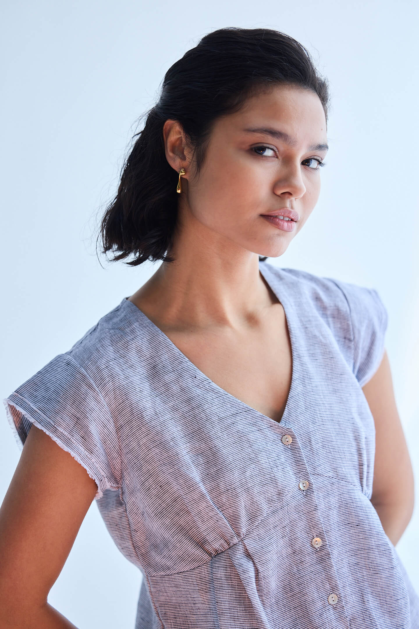 Close up of striped linen texture on Deep V-neck short top, Reistor.