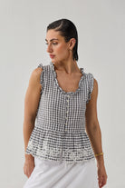 Women's Embroidered Peplum Top in Grey Check styled with a white skirt