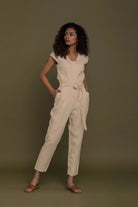 Reistor Evening Chai Jumpsuit in Neutral Beige with tie waist, tapered legs and timeless sustainable women's fashion.