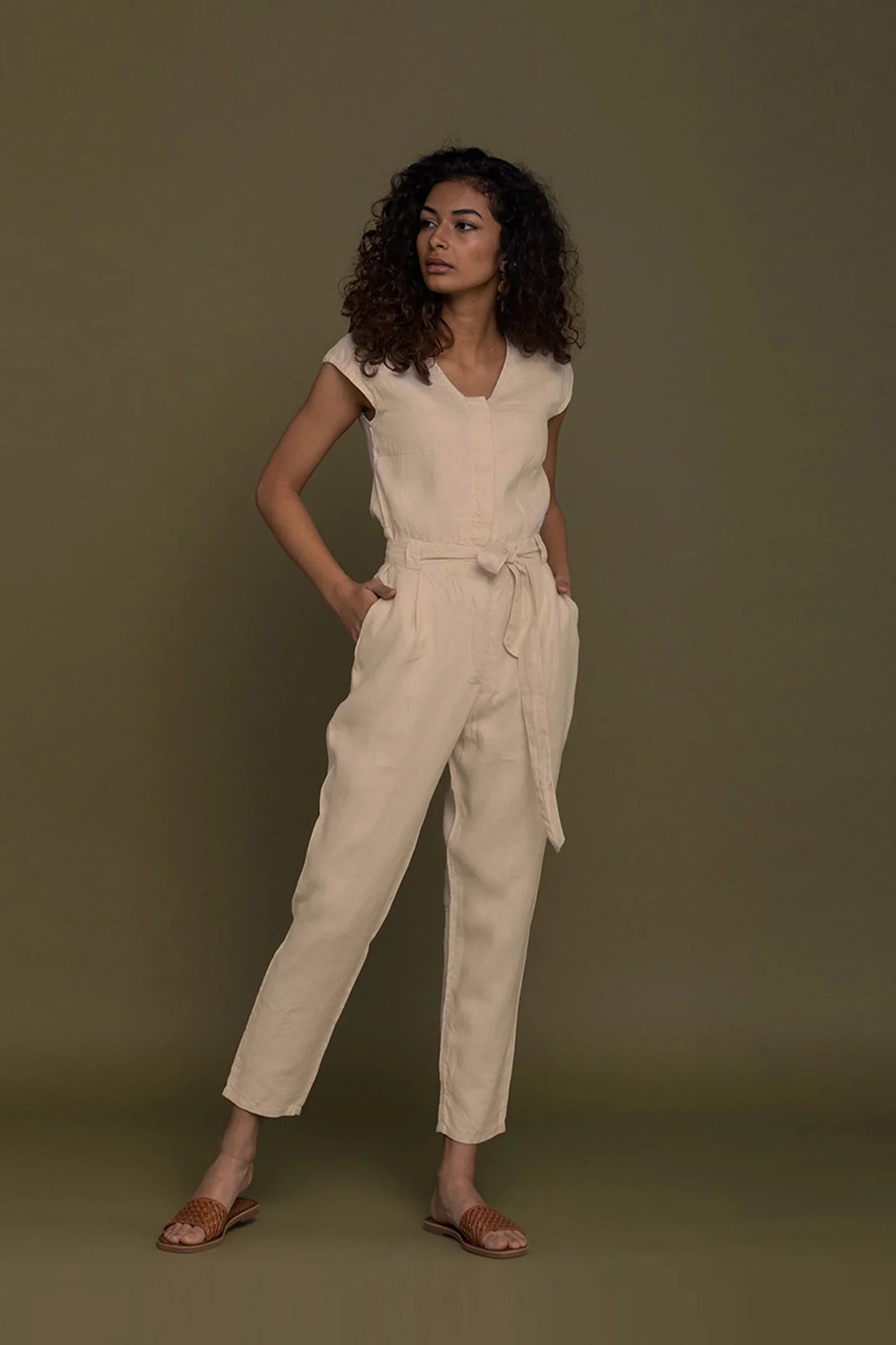 Reistor Evening Chai Jumpsuit in Neutral Beige with tie waist, tapered legs and timeless sustainable women's fashion.