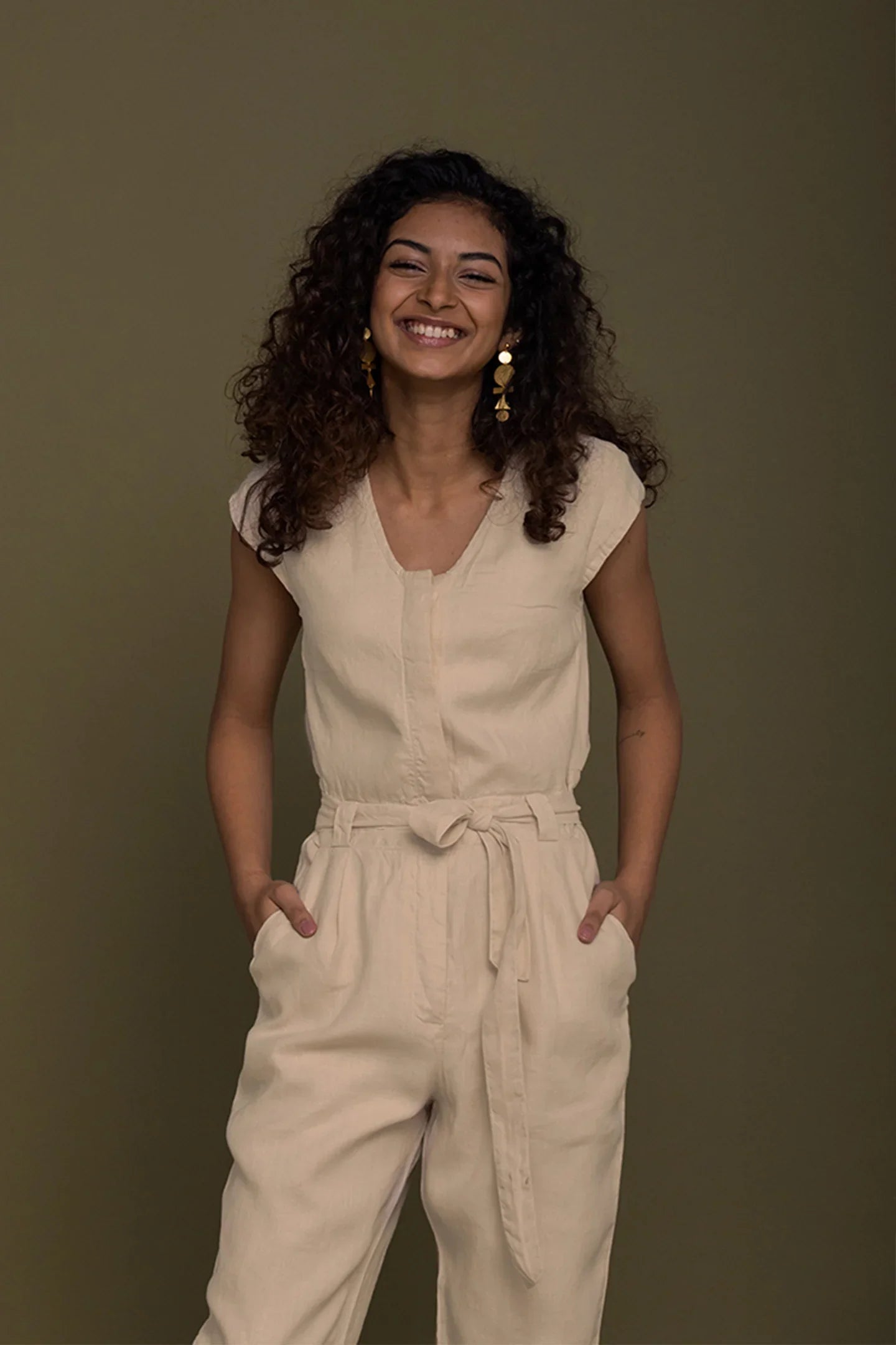 Reistor Evening Chai Jumpsuit in Neutral Beige for women with a sleeveless design, tie waist and relaxed fit