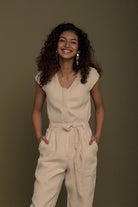 Reistor Evening Chai Jumpsuit in Neutral Beige for women with a sleeveless design, tie waist and relaxed fit