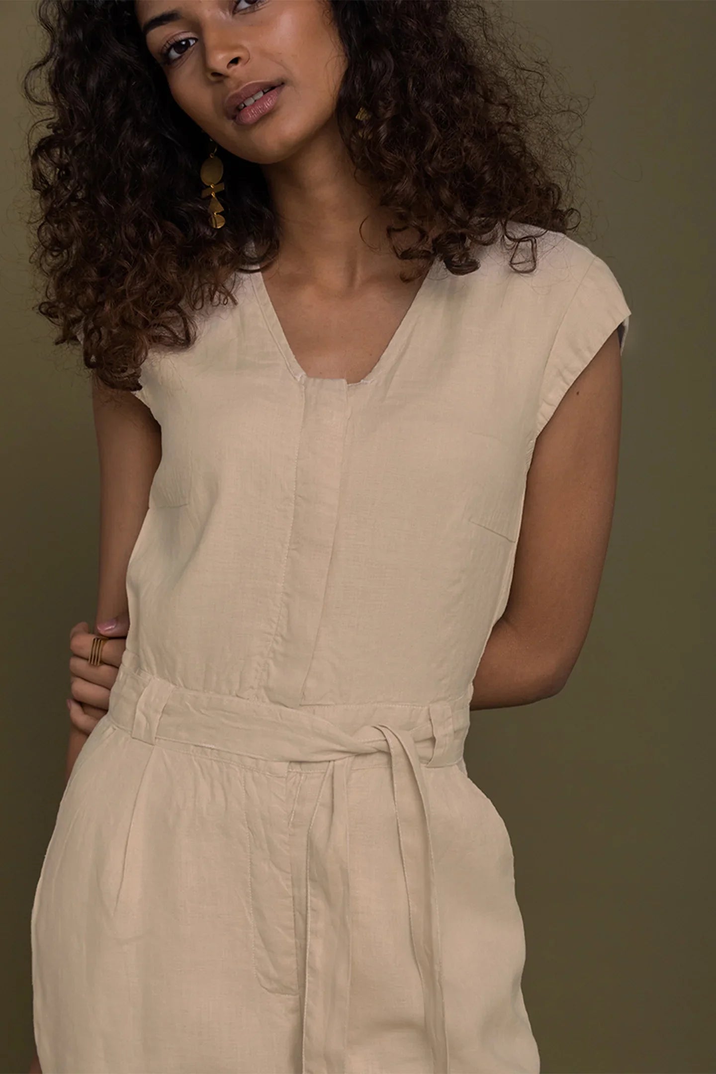 Reistor Evening Chai Jumpsuit in Neutral Beige for women with a flattering V-neck, tie waist and relaxed fit