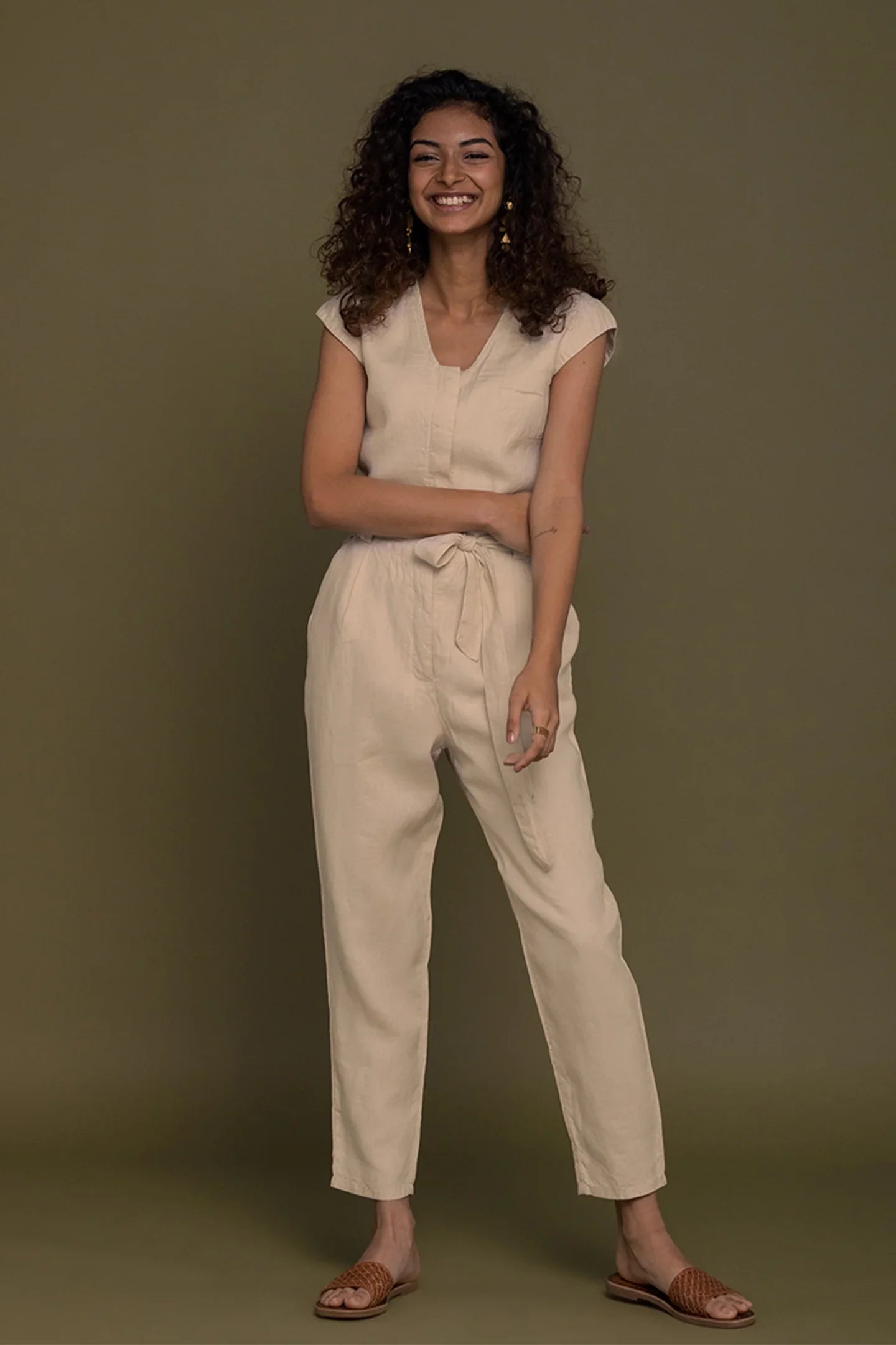 Reistor Evening Chai Jumpsuit in Neutral Beige for women with a sleeveless silhouette, tie waist and tapered leg