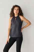 Elegant black halter top by Reistor featuring delicate neckline detailing and an easy fit designed for effortless day-to-evening wear.