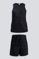 A studio product shot of the reistor Hemp Vest Jacket Set in Black, featuring a sleeveless button-down vest with front pockets and matching high-waisted drawstring shorts made from sustainable hemp fabric.