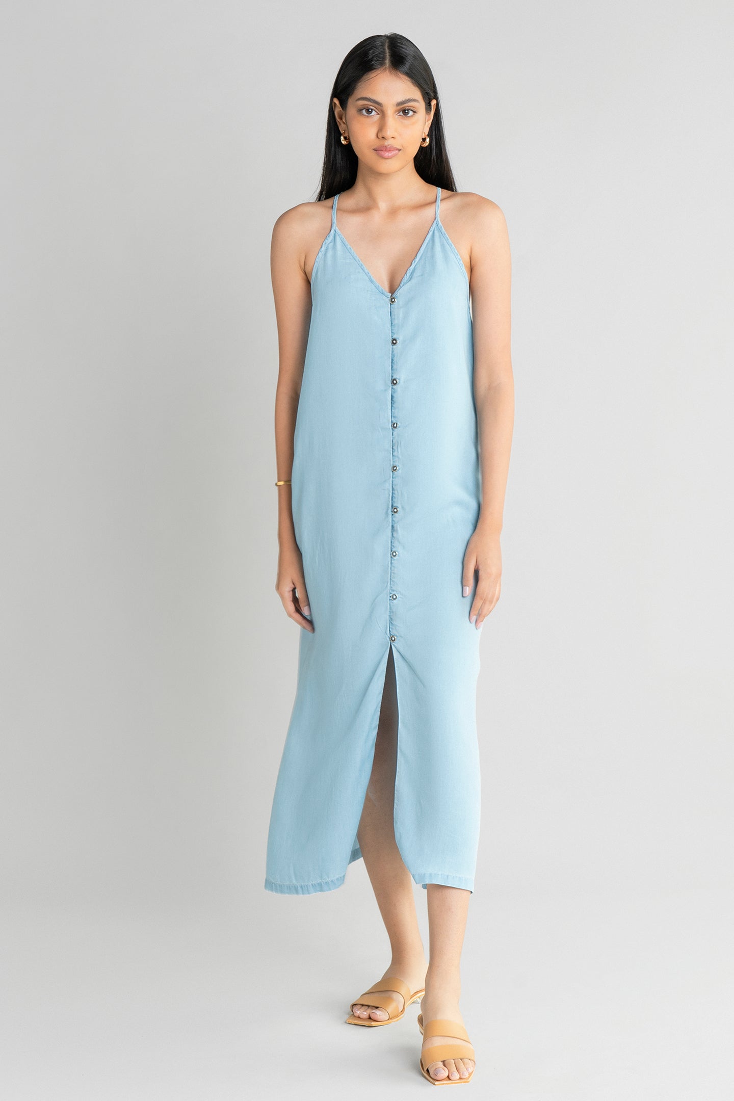 Full-length front profile of the Reistor In the Mood for Love Denim Midi Dress, highlighting breathable denim fabric, a relaxed drape and timeless everyday style.