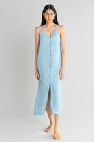 Full-length front profile of the Reistor In the Mood for Love Denim Midi Dress, highlighting breathable denim fabric, a relaxed drape and timeless everyday style.