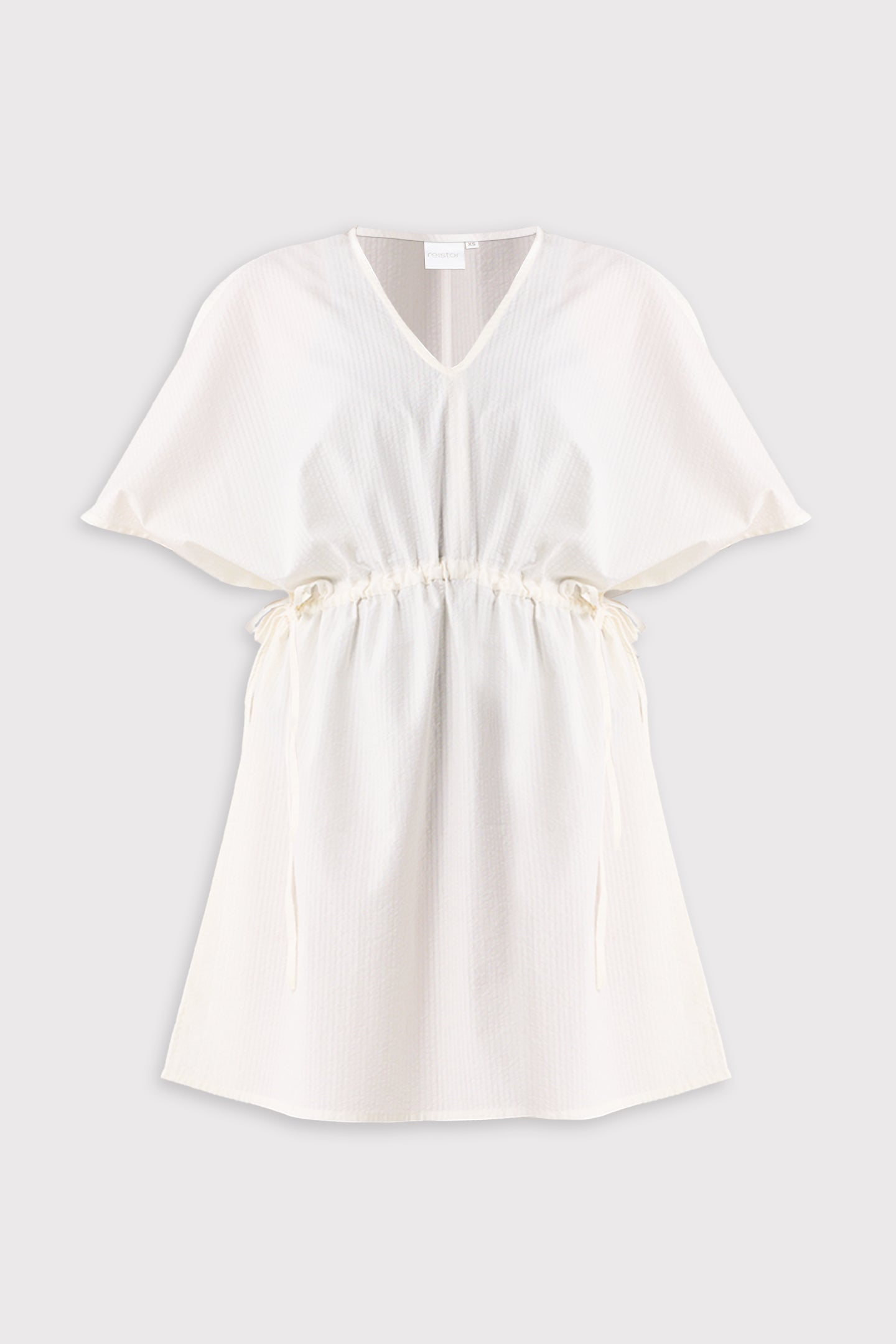 White dress on a light gray background
