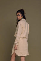Meet me by the Cliff Dress in Neutral Beige by Reistor, back view of a sustainable women's beige shirt dress