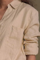 Meet me by the Cliff Dress in Neutral Beige by Reistor, close-up of the collar and pocket on a sustainable dress