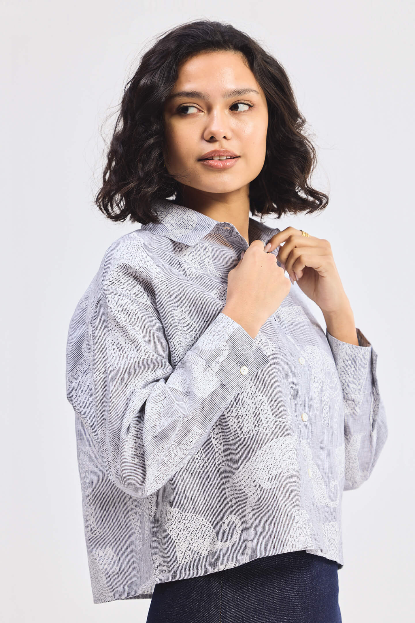 reistor Oversized Boxy-fit Shirt in Animal Print, side close-up view worn by model with denim skirt
