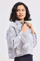 reistor Oversized Boxy-fit Shirt in Animal Print, side close-up view worn by model with denim skirt