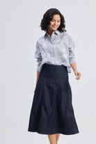 reistor Oversized Boxy-fit Shirt in Animal Print, model walking pose styled with denim midi skirt and wedge sandals