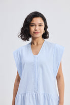 Reistor Oversized V-Neck Short Dress with Frayed Sleeves in light blue striped fabric, relaxed fit women’s summer dress with drop shoulders and soft breathable texture.
