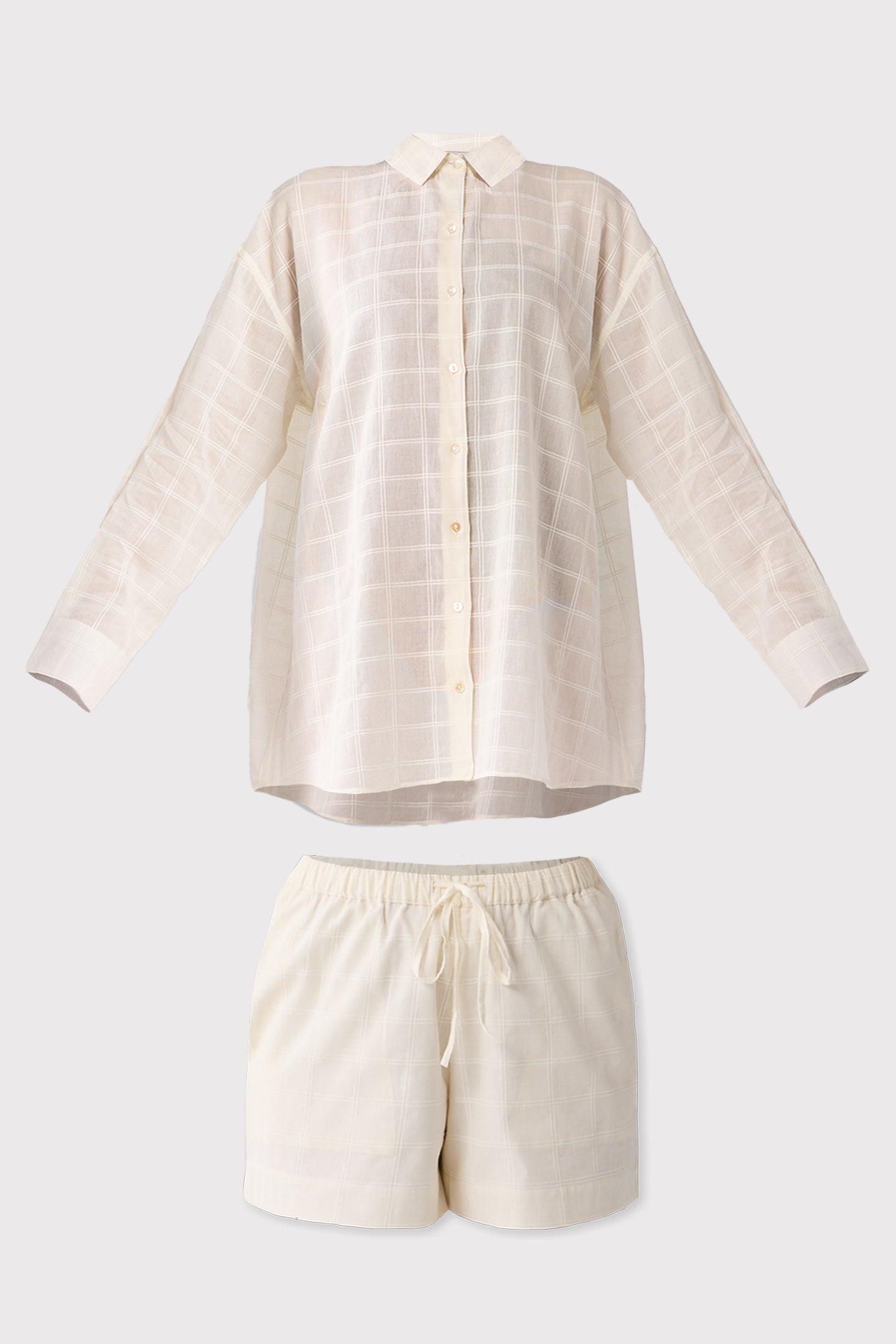 off-white shirt and shorts set on a light gray background