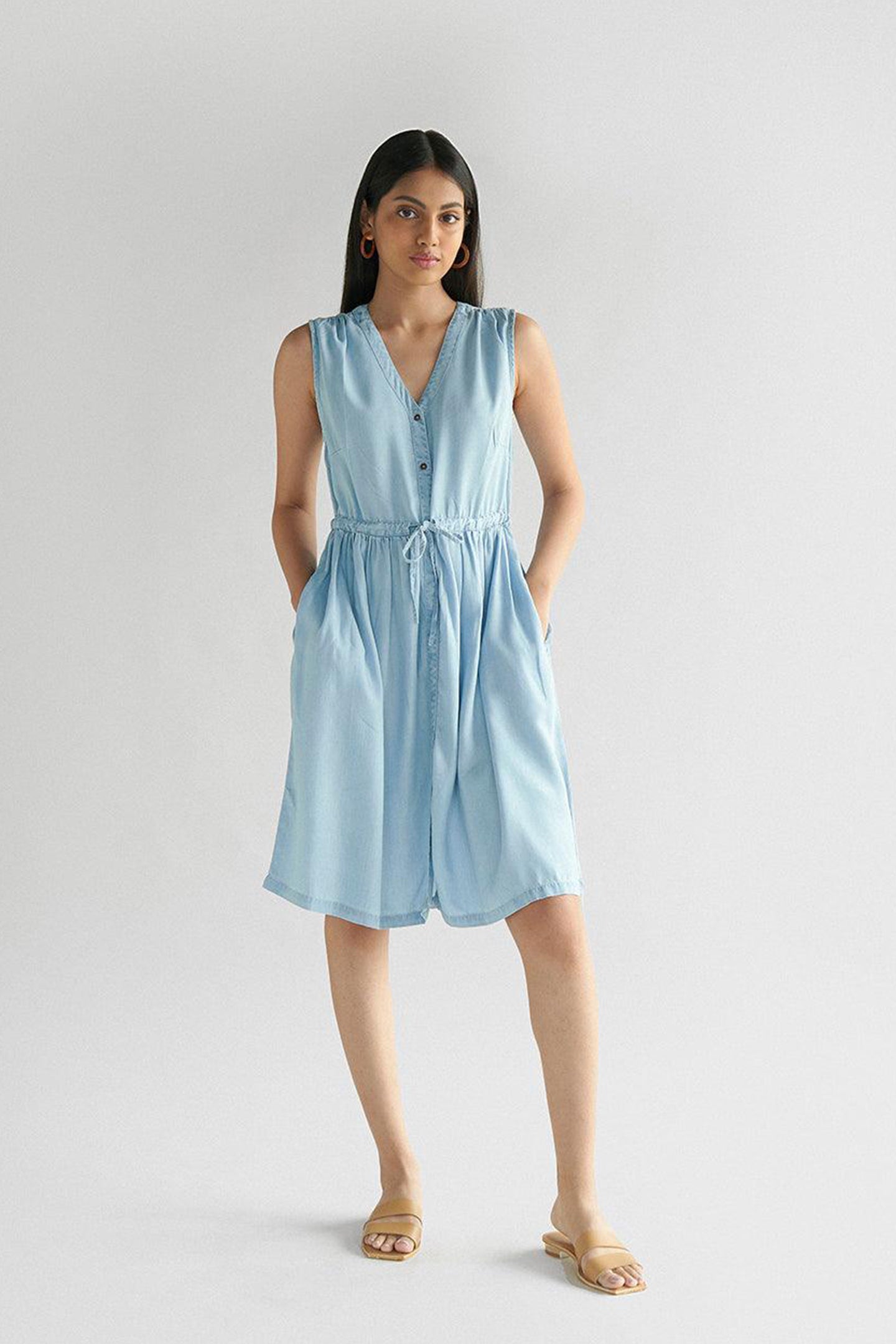 Reistor Pina Colada Dress in Ocean Blue, sleeveless V-neck dress with a button-front, adjustable drawstring waist and pockets, perfect for effortless summer style.