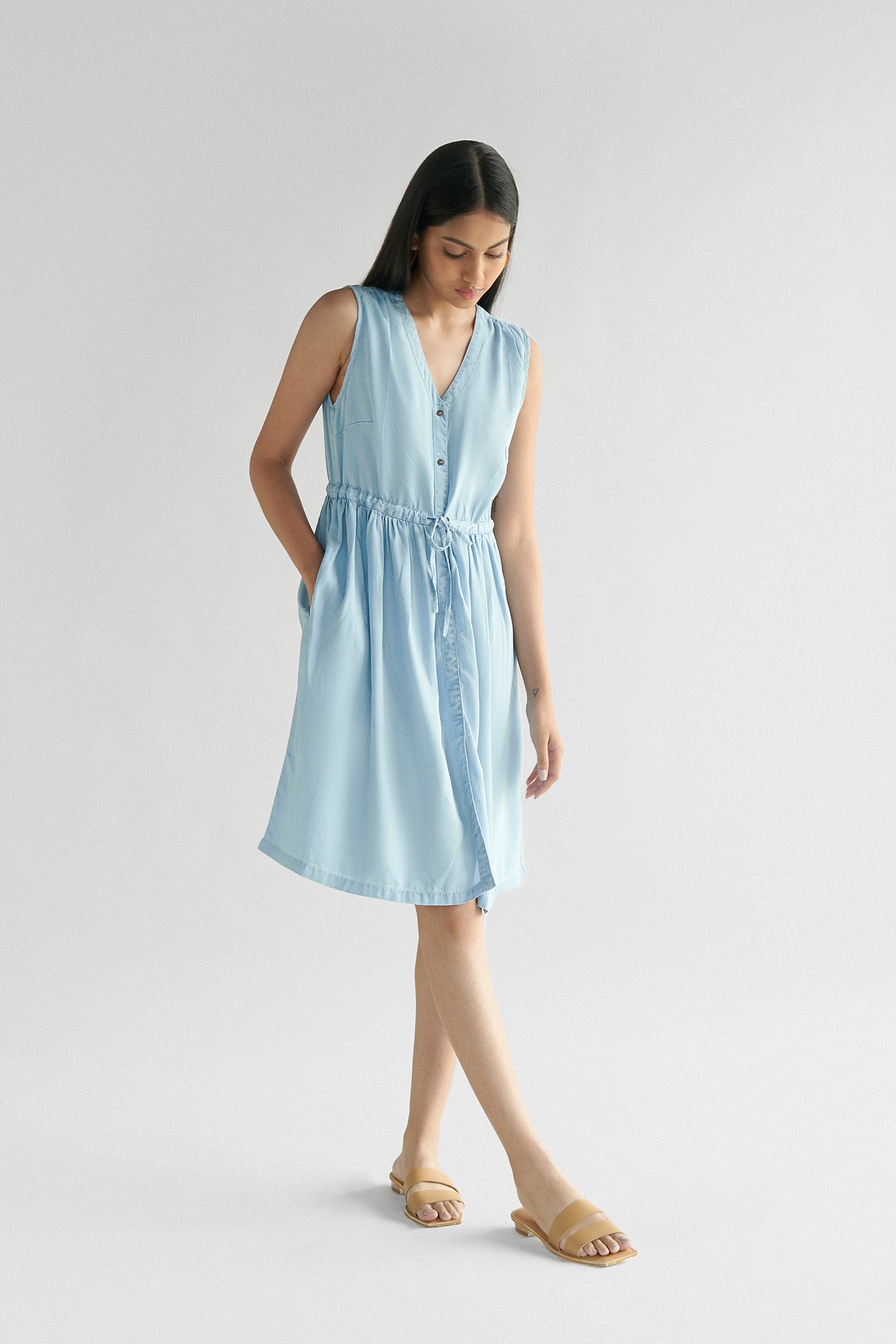 Reistor Pina Colada Dress in Ocean Blue, sleeveless V-neck midi dress with a drawstring waist, breathable sustainable women's summer dress for casual outings.