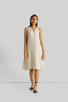 Reistor Reading Tea Leaves Dress in Ecru, sustainable sleeveless V-neck midi dress with a relaxed A-line fit, breathable fabric, and timeless style.
