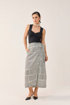 Reistor Regular Sweetheart Neck Top in Black paired with black and white geometric wide-leg pants, showcasing an elegant neckline and refined silhouette.