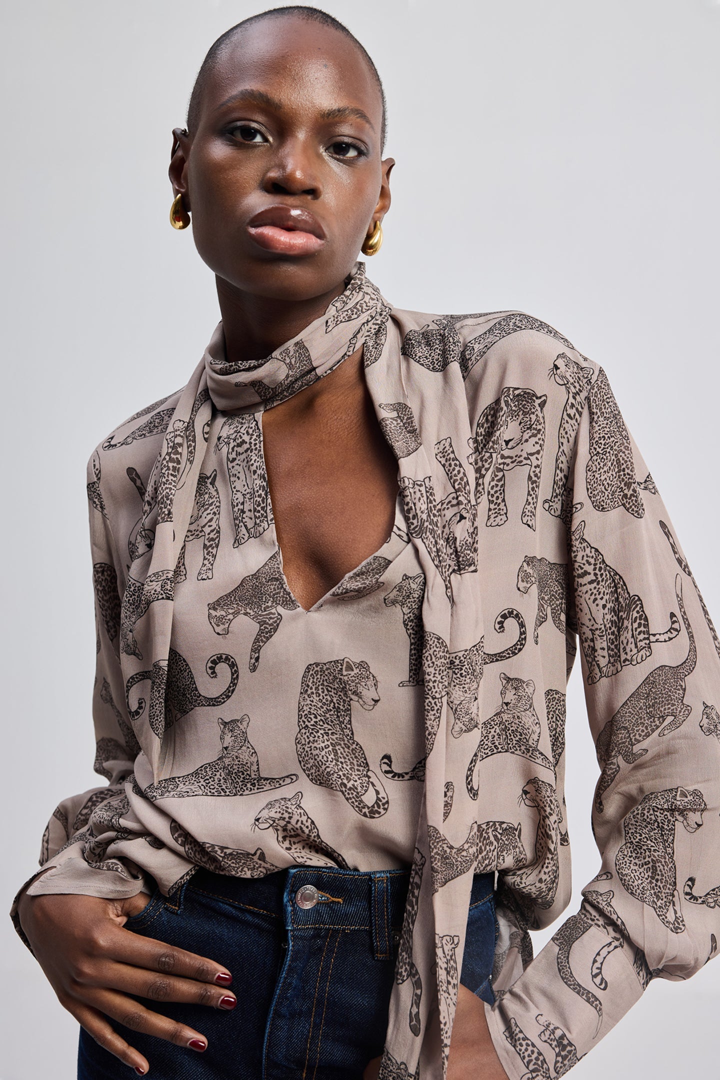 Reistor Relaxed-Fit Top with Front-tie in Animal Print, featuring a lightweight printed fabric, front tie-neck detail, long sleeves, and a modern relaxed silhouette.