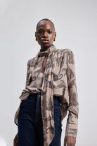 Relaxed-Fit Top with Front-tie in Animal Print by reistor, showcasing a relaxed silhouette blouse with long sleeves, front-tie neckline detail, and neutral animal print styling.