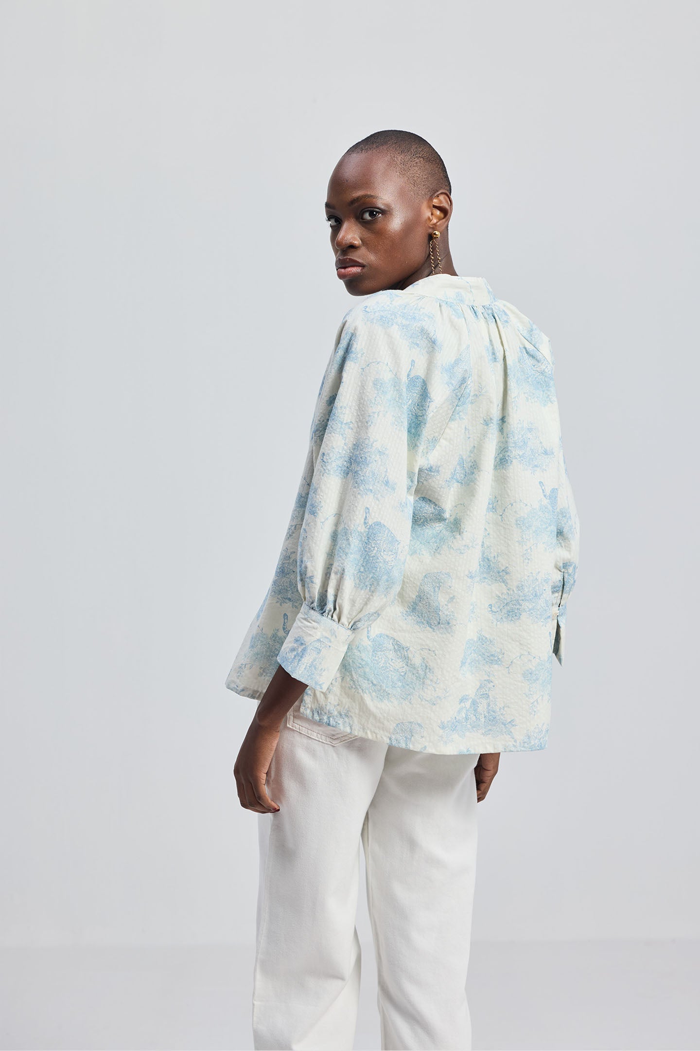 Back view of model wearing Relaxed-fit Shirt with Drawstring in Animal Print, showcasing the relaxed silhouette and lightweight design on a neutral background.