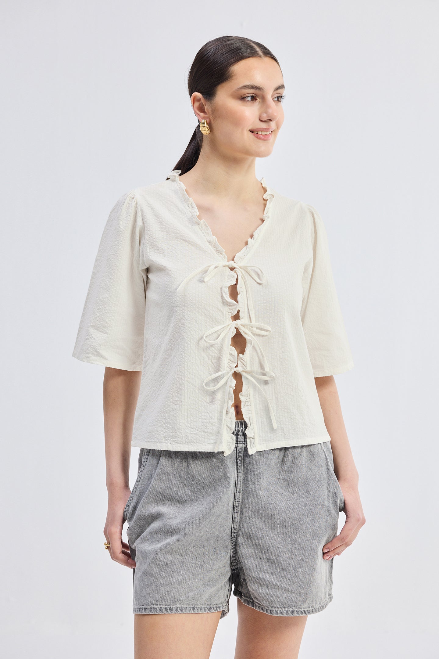 Relaxed Fit Top With Ruffles and Front-Ties in Cream Longshot