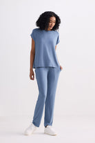 front-facing studio shot of a model wearing the reistor Relaxed Tee Set in Blue, showcasing the casual drape of the short-sleeve top and the comfortable, loose fit of the matching blue drawstring trousers.