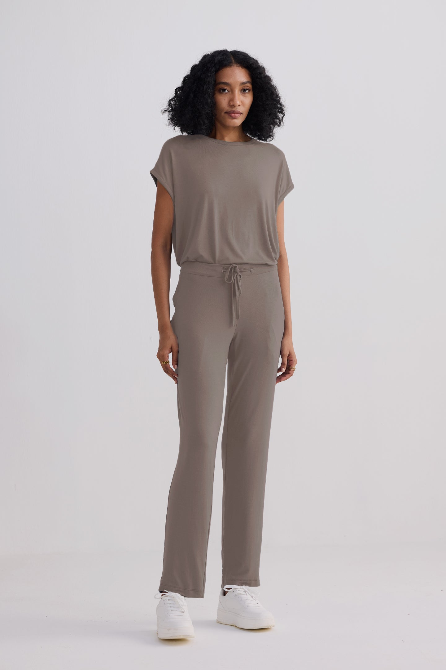 Woman wearing the Reistor Relaxed Tee Set in Earth Grey, an eco-friendly modal blend loungewear set.