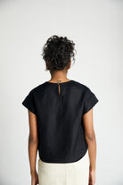 Reistor Sandcastle Saturdays Top in Black, sustainable women's cap sleeve top with a back keyhole detail, breathable fabric, and relaxed everyday fit.