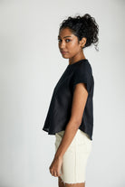 Reistor Sandcastle Saturdays Top in Black, sustainable women's cap sleeve top with a relaxed silhouette, breathable fabric, and minimalist everyday style.
