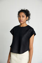 Reistor Sandcastle Saturdays Top in Black, sustainable women's cap sleeve top with a relaxed fit, breathable fabric, and timeless minimalist design.