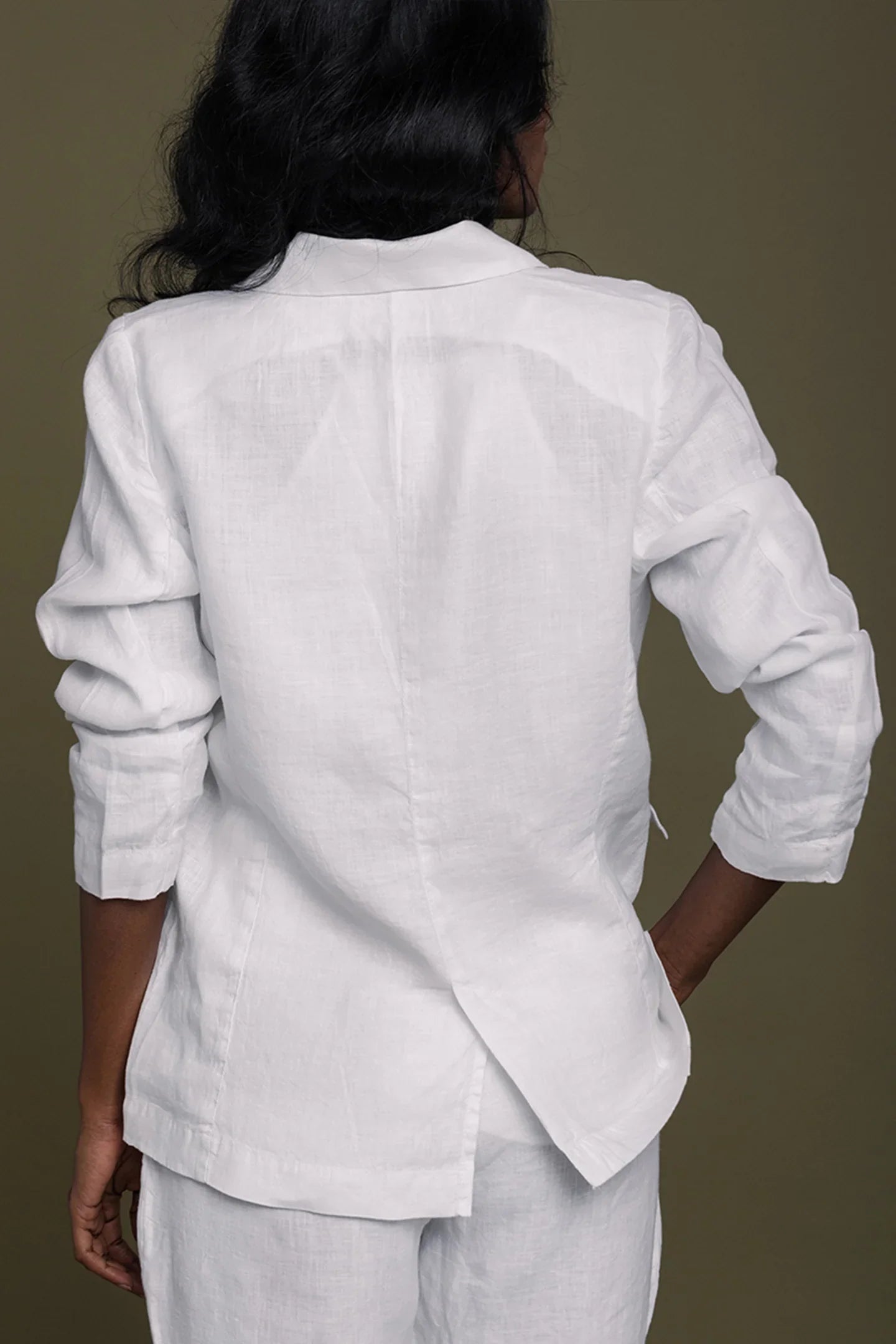 Back view of Reistor She's Everything Blazer in White with a tailored fit, timeless sustainable women's fashion style.