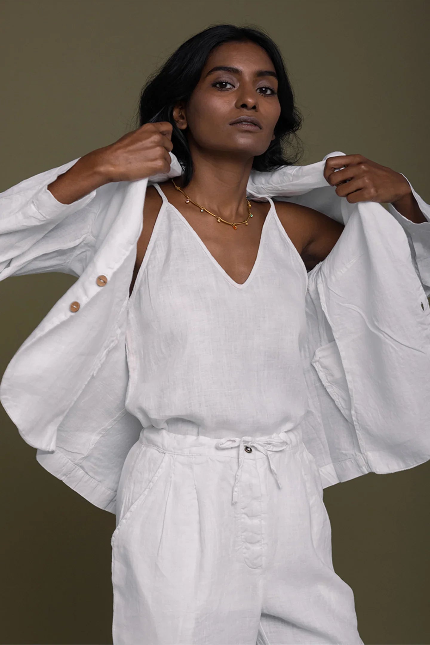 Reistor She's Everything Blazer in White styled over a white V-neck top, timeless sustainable women's fashion look.