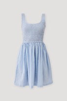 Blue striped dress on a light gray background