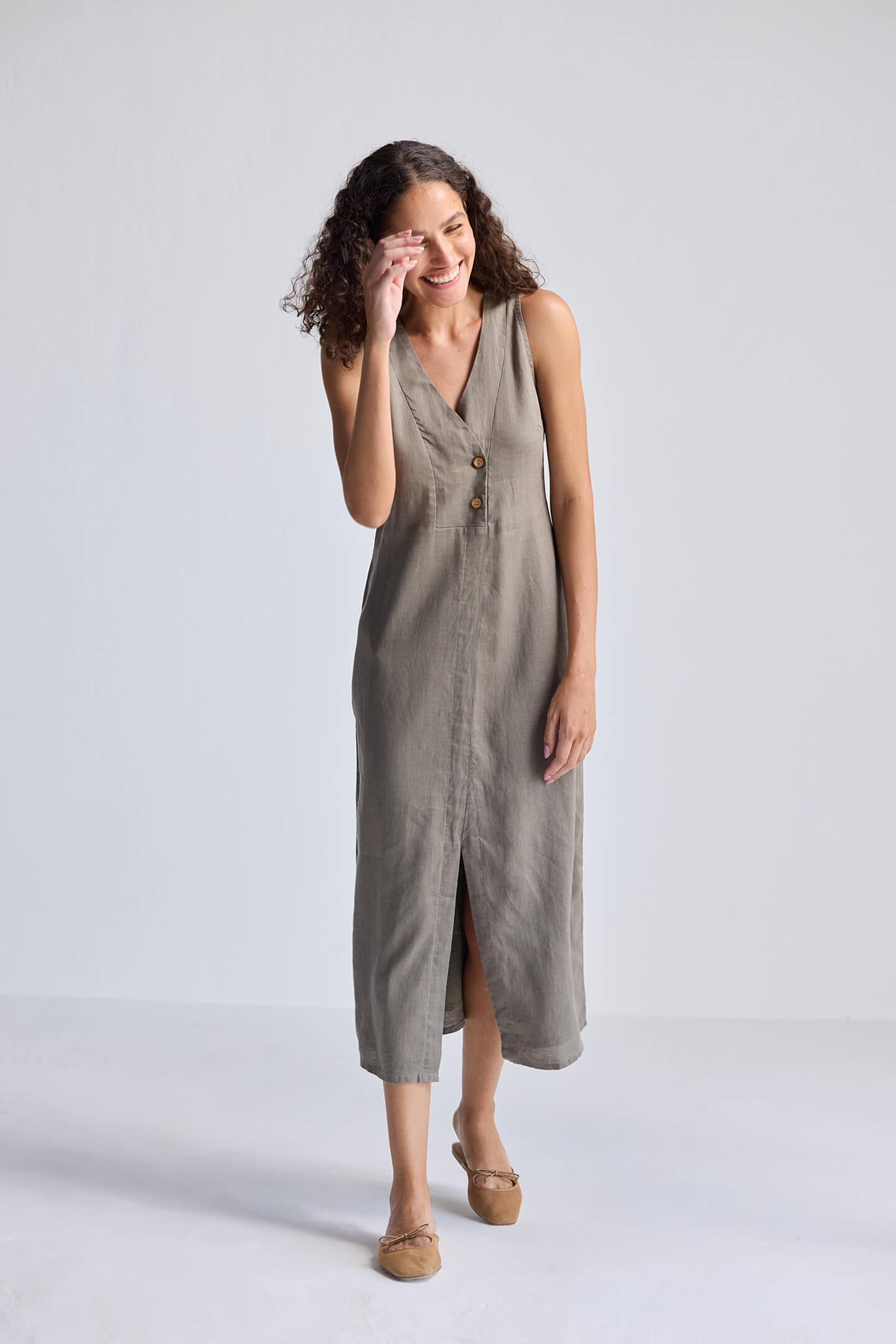 Model smiling while wearing Straight Dress with Front Slit in Dark Green Hemp by reistor
