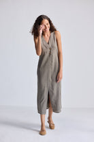 Model smiling while wearing Straight Dress with Front Slit in Dark Green Hemp by reistor