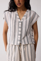Close-up front view of Striped Matching Set with Wide-Leg Pants and V-neck Top for women, showcasing the V-neckline, button detail, and vertical stripe pattern.