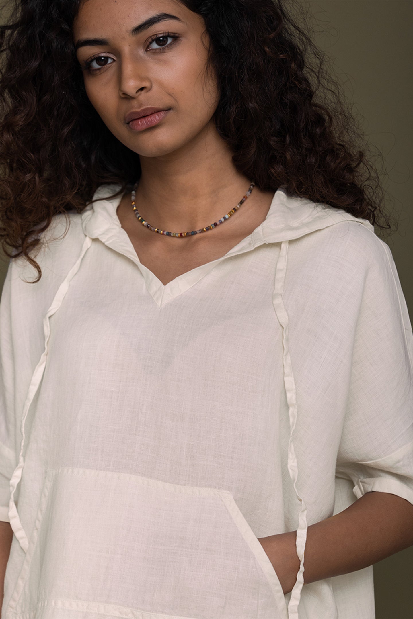 Reistor The Hemp Hoodie featuring a soft off white finish, relaxed hooded neckline, front pocket, and breathable hemp fabric