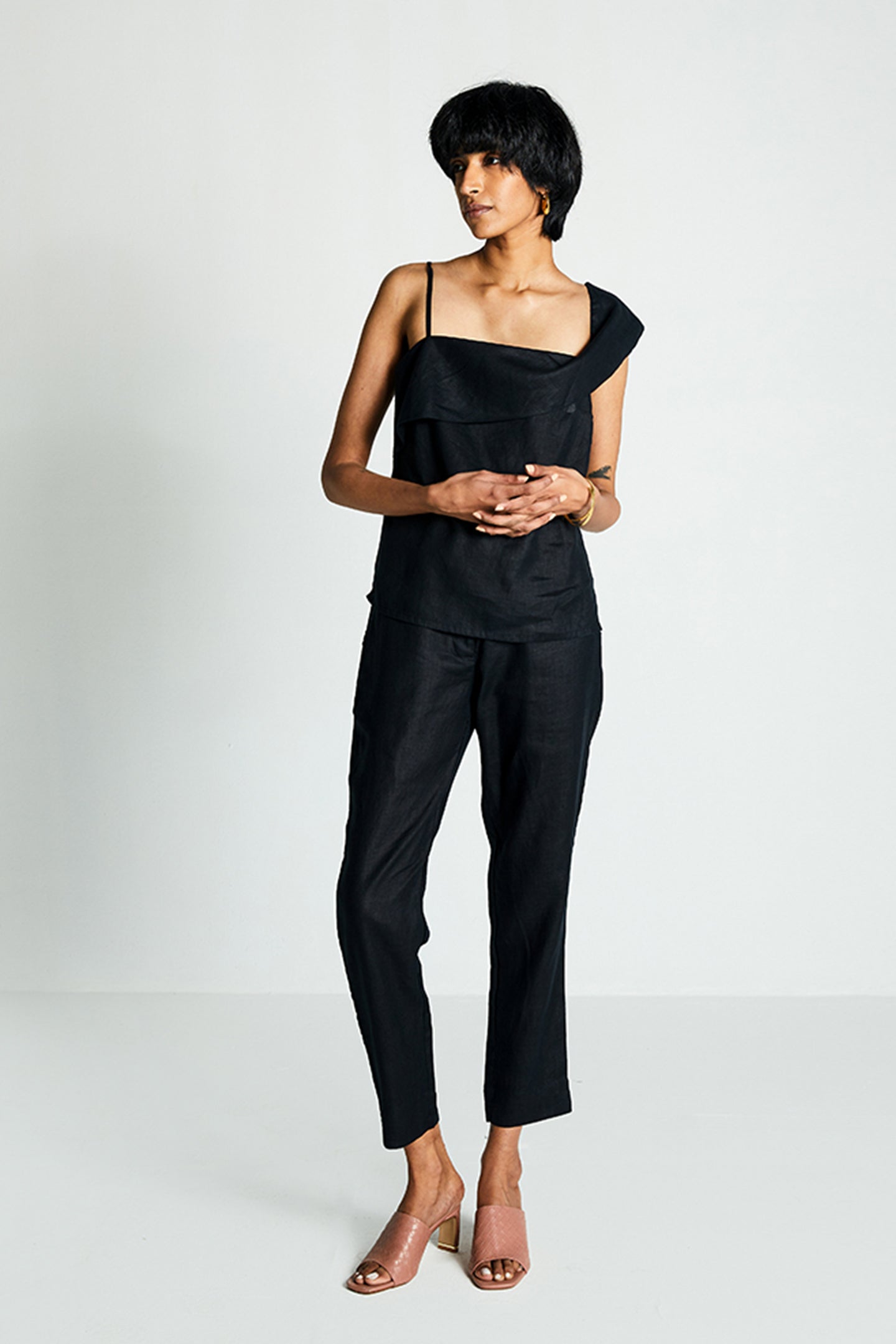 Reistor The Wandering Wave Top in Black, sustainable women's asymmetrical top with breathable fabric, relaxed fit, and minimalist everyday fashion.