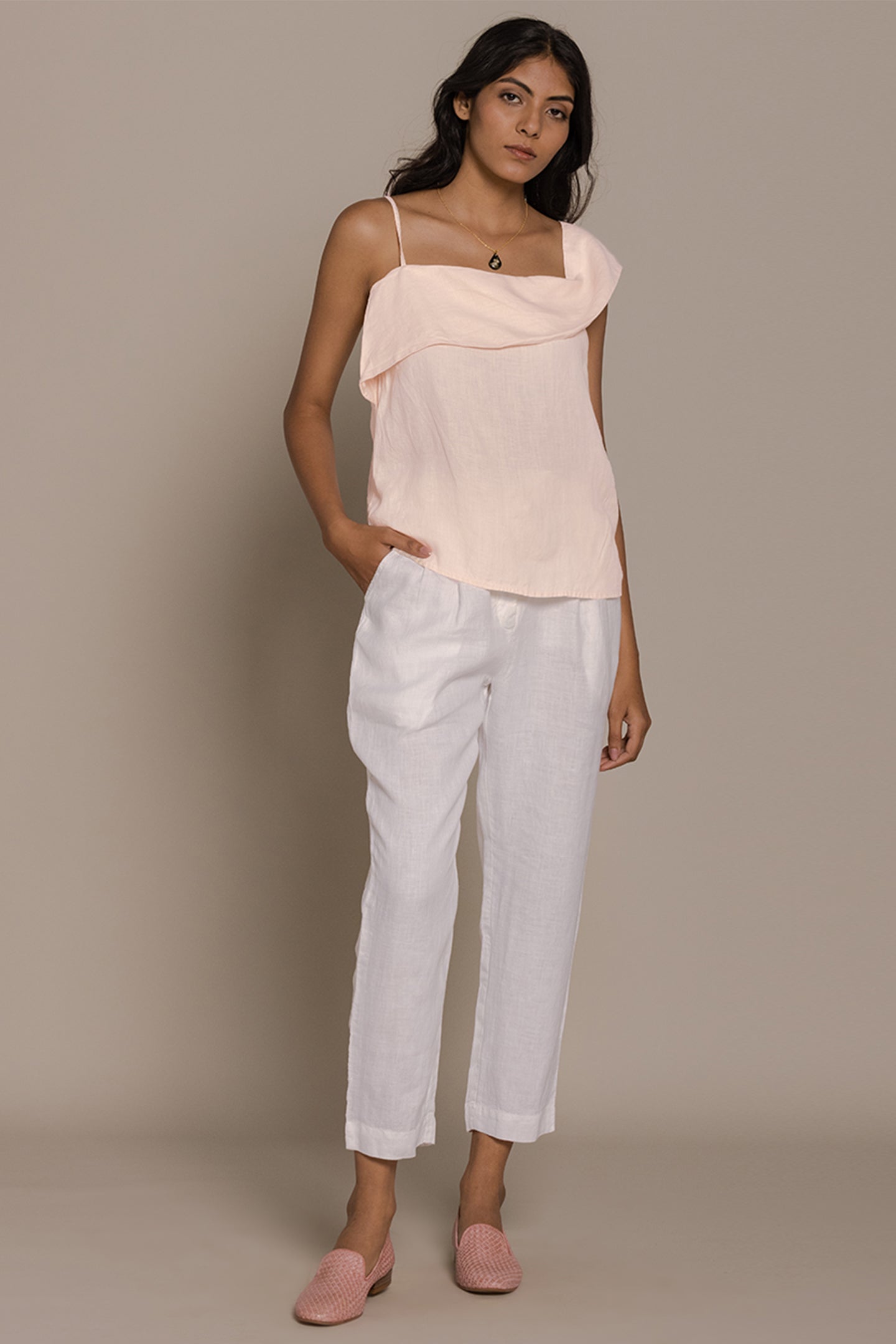 Reistor The Wandering Wave Top in Ice Pink pairs a fluid asymmetric drape with effortless everyday style.