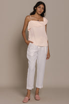 Reistor The Wandering Wave Top in Ice Pink pairs a fluid asymmetric drape with effortless everyday style.