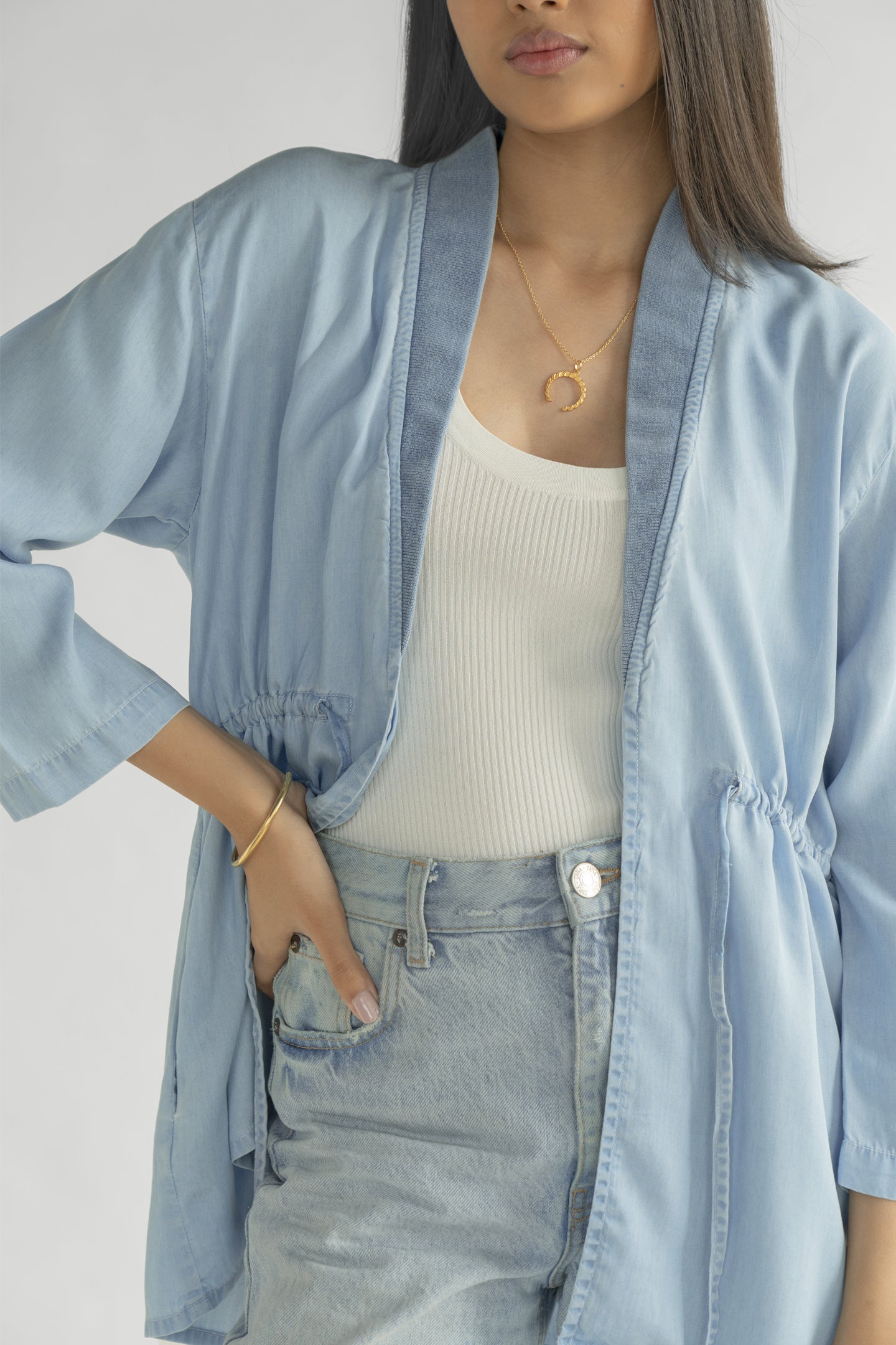 Detailed view of the Reistor Travel Light Denim Jacket in Ocean Blue, featuring premium lightweight denim, an open-front design and a flattering relaxed fit.