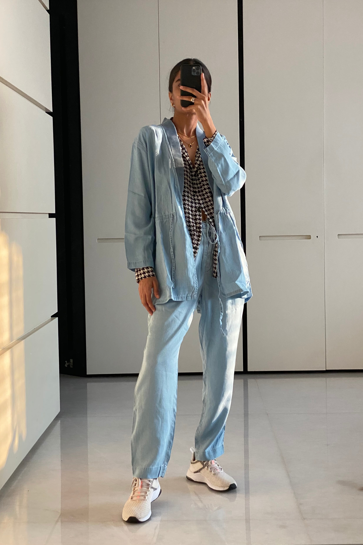 Model wearing the Reistor Travel Light Denim Jacket in Ocean Blue, paired with matching denim for a coordinated look in breathable sustainable style.